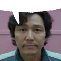 a close up of a man 's face with a speech bubble above his head .
