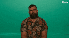 a man with a beard and a hawaiian shirt says do we go home