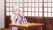 a girl sitting at a table with playing cards in her hands