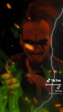 a cartoon drawing of a man 's face with a tiktok logo
