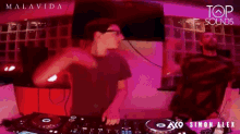 two men are playing music at top sound