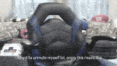 a black and blue chair with the words " i forgot to unmute myself lol enjoy this music tho " below it