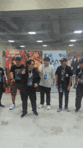 a group of people standing in front of a sign that says utane