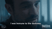 a man says i was immune to the darkness in a daredevil born again poster