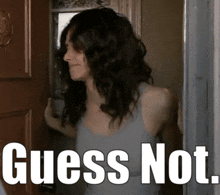a woman standing in front of a door with the words " guess not " written below her