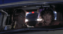 two women in a car with the words " i bet you were the brightest in your class weren 't you " below them