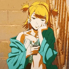 a girl wearing headphones is leaning against a wall and looking at her phone