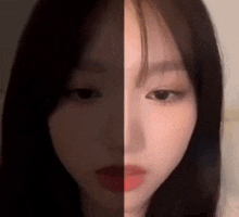 a close up of a woman 's face with half of her face visible .