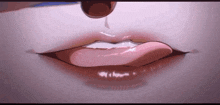 a close up of a person 's mouth with a drop of liquid coming out of it