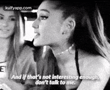 ariana grande is talking to another woman in a black and white photo while driving a car .