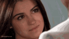 a close up of a woman 's face with the words site mai perroni visible in the corner
