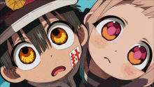a boy and a girl are looking up at the camera and the girl has a red sticker on her face that says 封