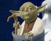 a statue of yoda holding a cane in a blue bag
