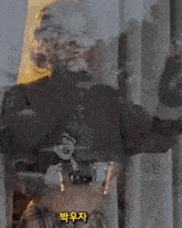 a woman is standing in front of a window with a reflection of her face in the window .