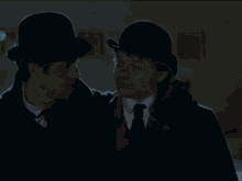 two men are standing next to each other and one is wearing a top hat