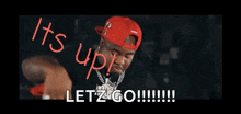 a man wearing a red hat says it 's up letz go !!!