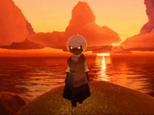 a person standing on a rock in front of a body of water at sunset