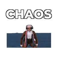 a man in a suit is standing in front of the ocean with the word chaos behind him