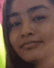 a close up of a woman 's face making a funny face .