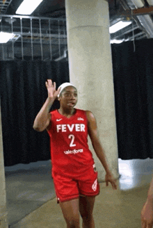a female basketball player wearing a fever 2 jersey