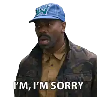 a man wearing a blue hat and a jacket says i 'm sorry