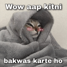 a cat is wrapped in a blanket with the words wow aap kitni bakwas karte ho