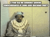 a man in a clown costume is sitting at a table with a funny caption .