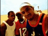 a man wearing a jersey with the number 12 poses for a picture