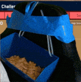 a blue box of chips sits next to a chair with a blue duct tape around it