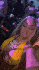a woman is taking a picture of herself in a club .