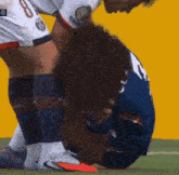 a soccer player with the number 8 on the back of his jersey