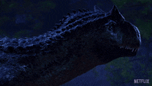 a blurry picture of a dinosaur with netflix written on the bottom right