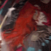 a close up of a person with red hair holding a sword in a painting .