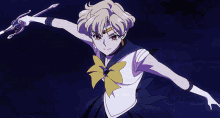 a girl in a sailor suit is holding a sword in her right hand