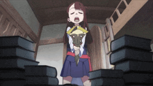 a girl in a blue skirt is standing in front of a stack of books holding a stuffed animal