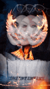 a painting of a woman with flames coming out of her face and the word company below her