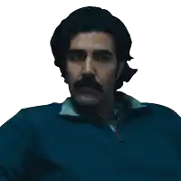 a man with a mustache is wearing a blue shirt