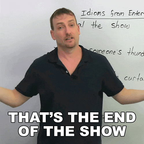 a man stands in front of a whiteboard with the words that 's the end of the show written on it