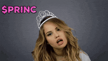 a woman wearing a tiara with the words " i 'm a princess " above her
