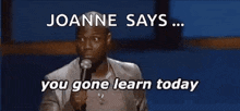 a man is speaking into a microphone and says joanne says ... you gone learn today