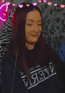 a woman wearing a sweater that says иязv