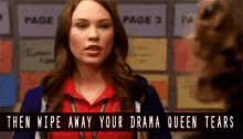 a woman in a red shirt is talking to another woman in front of a sign that says page 3