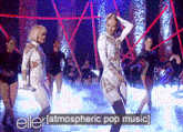 a group of women are dancing on a stage with the words " atmospheric pop music " at the bottom