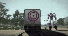 a robot standing in front of a target truck