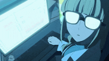 a girl with glasses is looking at a computer screen