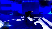 a smackdown live advertisement with a man standing on a stage