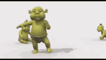 two shrek babies are doing a handstand on a white surface .