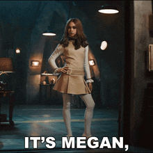 a woman standing in a dark room with the words it 's megan below her