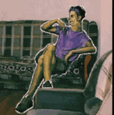 a man in a purple shirt sits on a chair with his legs crossed