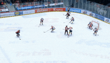 a hockey game is being played on a ice rink with advertisements for tipsport and tatra